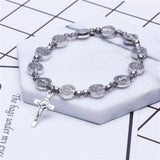 Gouden en zilveren Christelijk kruisarmband – Solana