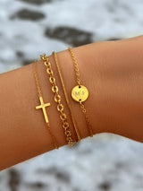 Gouden en zilveren kruisarmband