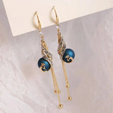 PlumeElegance | Verhoog je stijl met prachtige pauwenoorbellen!